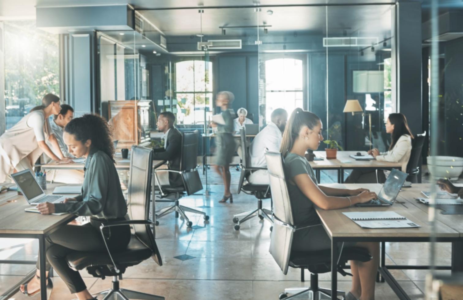 Professional workspace with SEO analytics and tools displayed on multiple screens